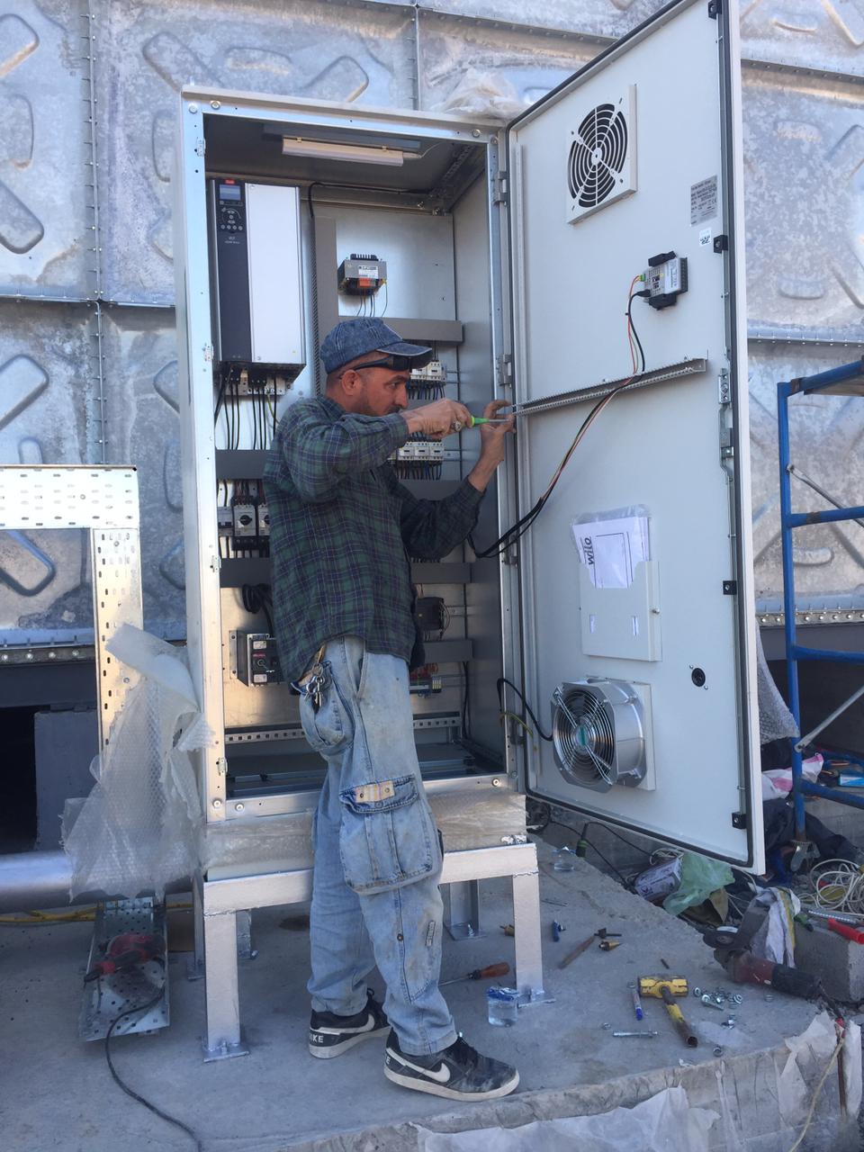 Maintenance technician working on industrial machine